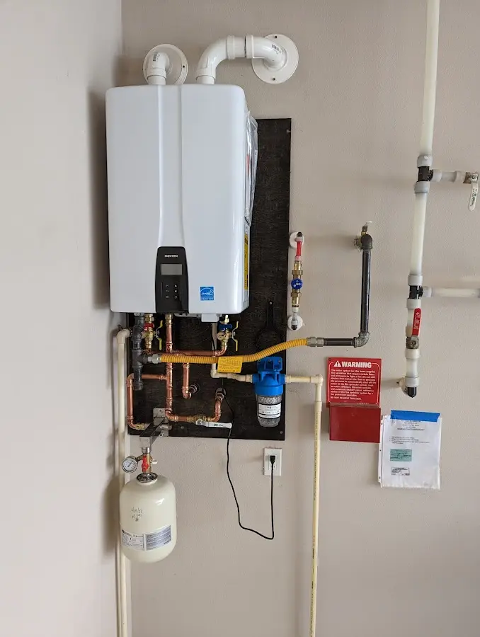 Professional plumber installing copper piping in a Agoura Hills home